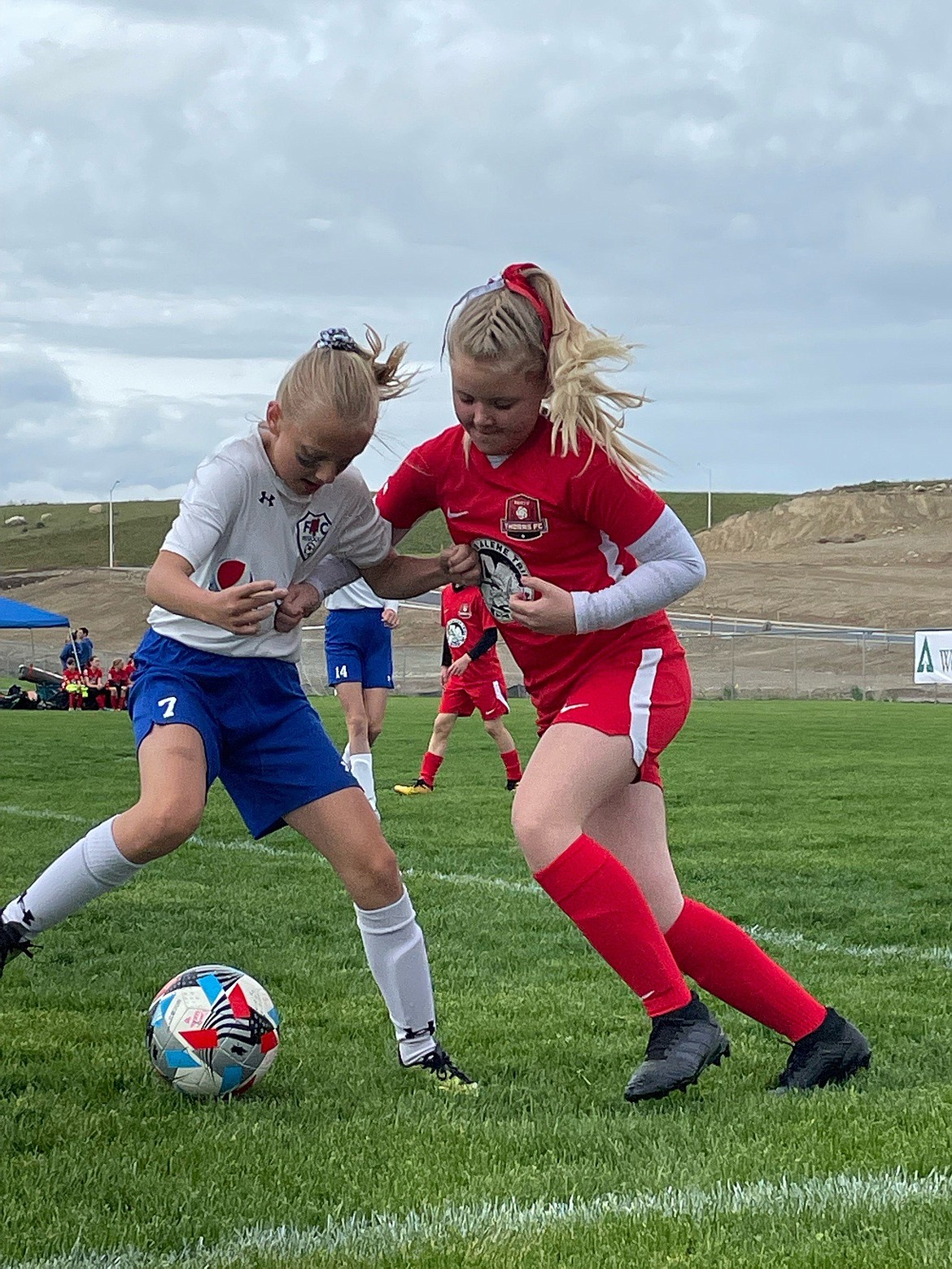 Photo by ANNIE ELGEE
The Thorns North FC 2011 Girls Yellow soccer team competed in the 3 Blind Refs Tournament in Kalispell, Mont., over the weekend. The Thorns won their first game in the gold bracket against FC Missoula 1-0, with Hailey Viaud protecting the goal and Kylie Lorona scoring the game's only goal, but lost their next three games. During those games, Brightyn Gatten scored two goals and Aubrey Sargent scored two goals. Pictured is Eloise Elgee, right, of the Thorns, playing defense in the win against FC Missoula.