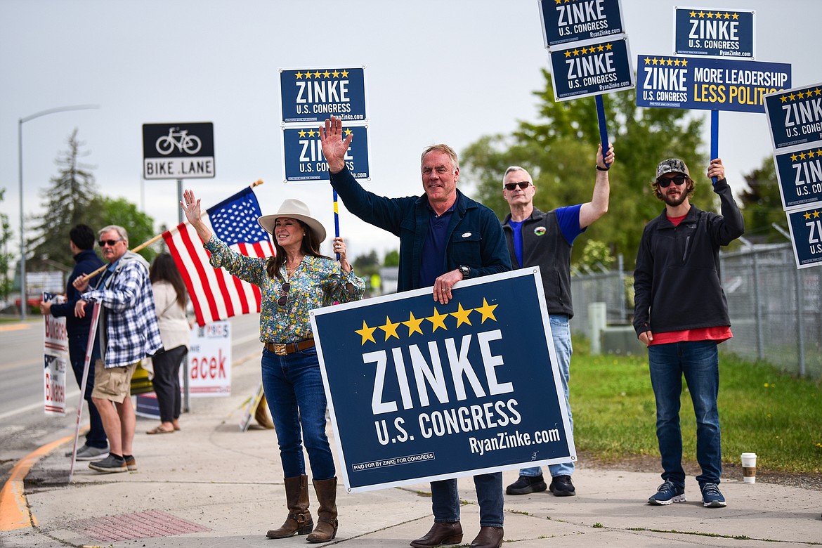 Montana U.S. House candidate and former Secretary of Interior Ryan Zinke waves to passing motorists outside the Flathead County Fairgrounds in Kalispell on Tuesday, June 7. (Casey Kreider/Daily Inter Lake)