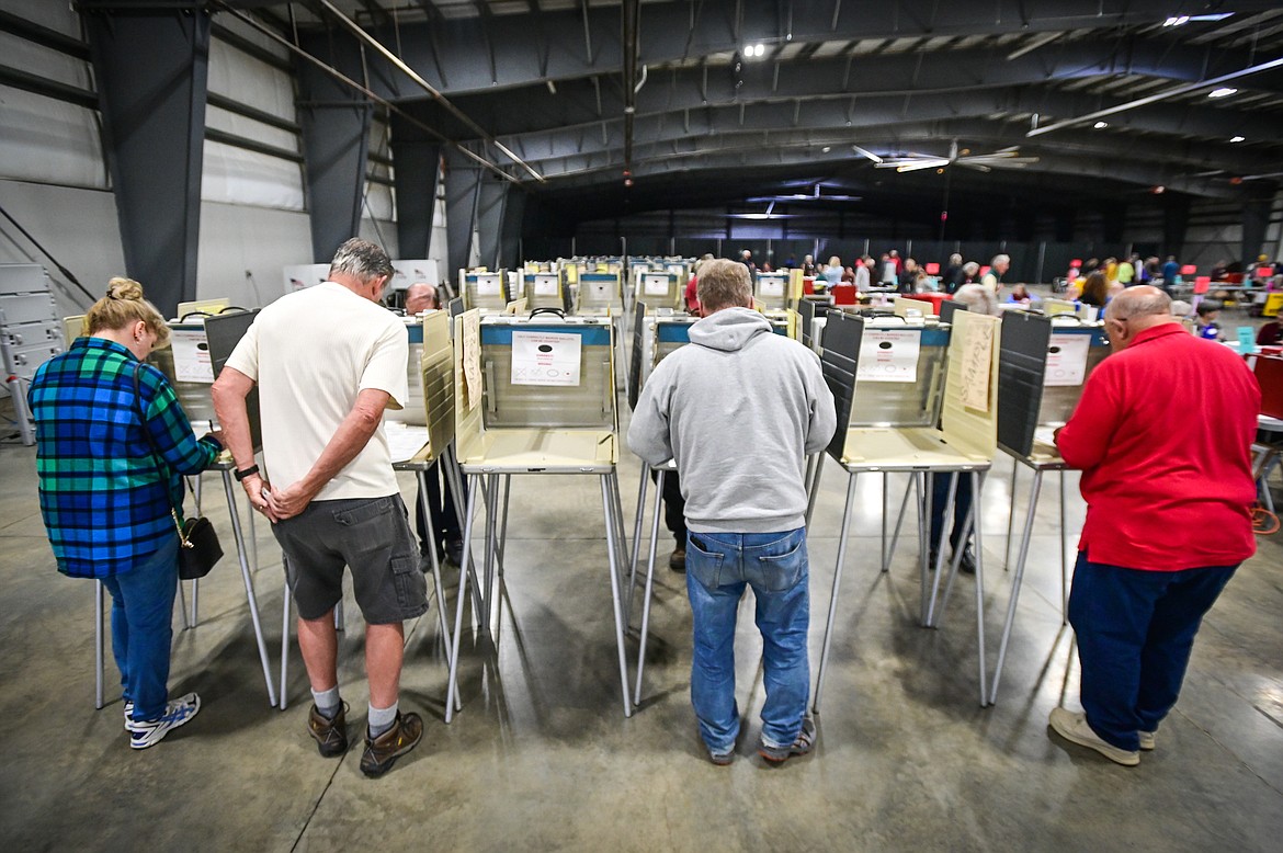 Voters fill out their ballots for the primary election at the Flathead County Fairgrounds in Kalispell on Tuesday, June 7. (Casey Kreider/Daily Inter Lake)