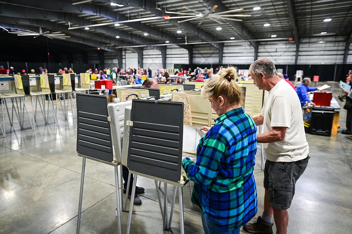 Brenda and Jim Roy fill out their ballots for the primary election at the Flathead County Fairgrounds on Tuesday, June 7. (Casey Kreider/Daily Inter Lake)