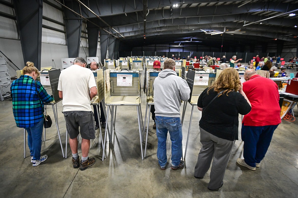 Voters fill out their ballots in the primary election at the Flathead County Fairgrounds in Kalispell on Tuesday, June 7. (Casey Kreider/Daily Inter Lake)