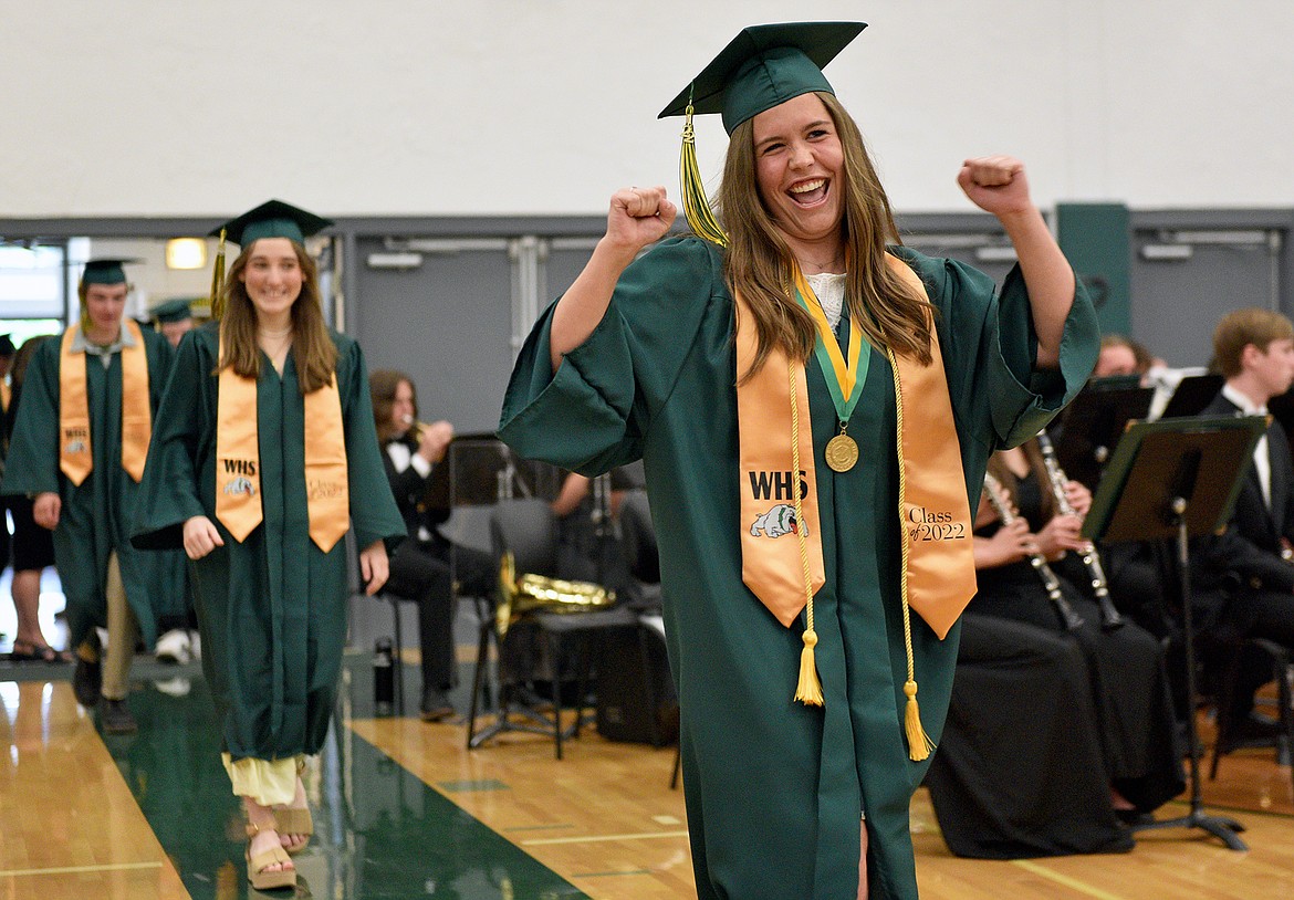 Whitefish student body president Emma Barron celebrates graduation day walking into the gym for the commencement ceremony. Whitefish High School graduated 131 seniors with the Class of 2022 Saturday during a commencement ceremony at the high school gym. (Whitney England/Whitefish Pilot)