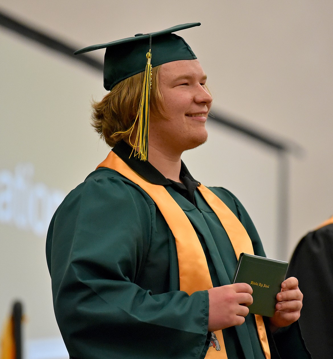 Ashton Akey graduates with the Whitefish High School Class of 2022 Saturday during a commencement ceremony at the high school gym. (Whitney England/Whitefish Pilot)