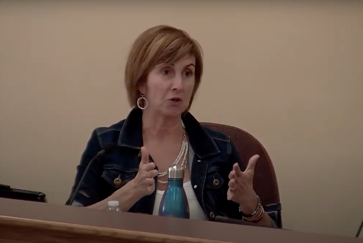 Coeur d'Alene School Board Trustee Lesli Bjerke asks questions about social studies materials during the school board meeting Monday. The board moved to adopt the resources, without certain supplemental materials that were questioned by reviewers and those who shared public comment.