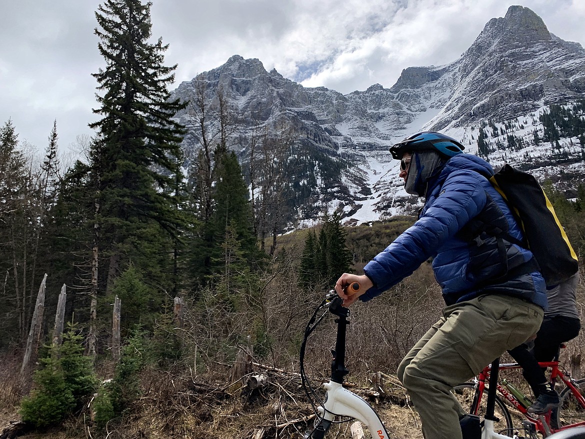 Roam Beyond co-founder Jake Haupert makes his way past Mt. Cannon on the Going to the Sun Road Saturday, May 21, 2022. (Jeremy Weber/Daily Inter Lake)