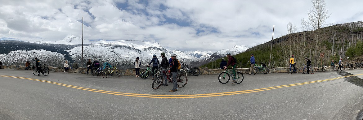 Cyclists rest at the Big Bend on the Going to the Sun Road in Glacier National Park Saturday, May 21, 2022. (Jeremy Weber/Daily Inter Lake)