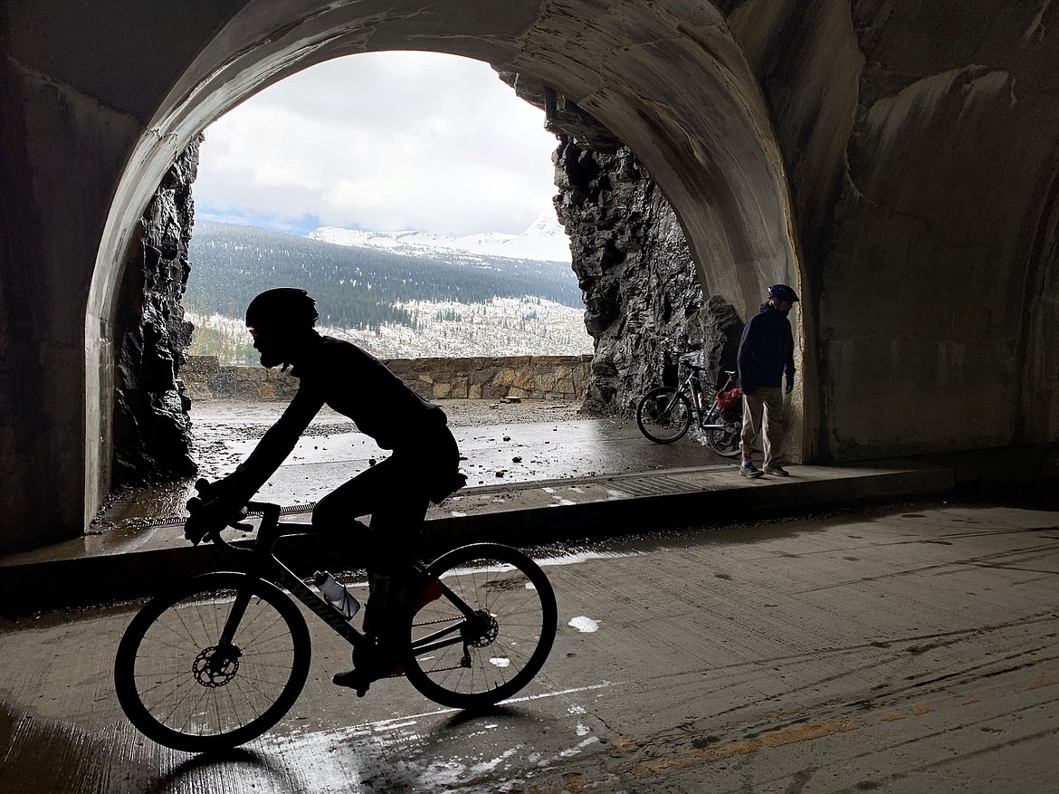 Cyclists make their way through the West Tunnel on the Going to the Sun Road in Glacier National Park Saturday, May 21, 2022. (Jeremy Weber/Daily Inter Lake)