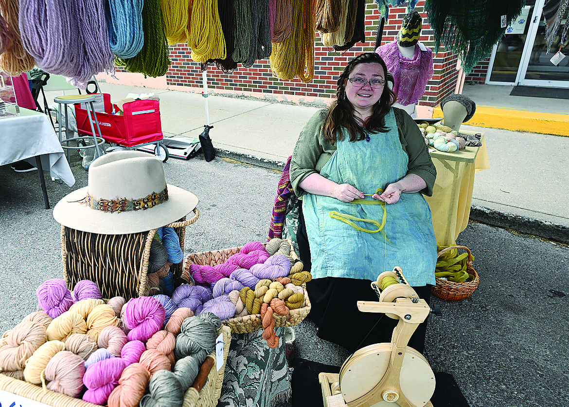 Madeline Keller-King spins wool at the new Sunday market last week.
