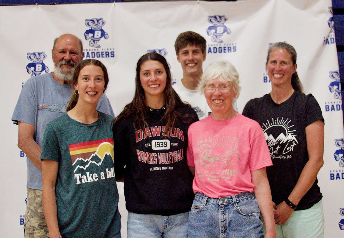 (center) Sierra Petesch with her family. Petesch will be playing volleyball at Dawson College.