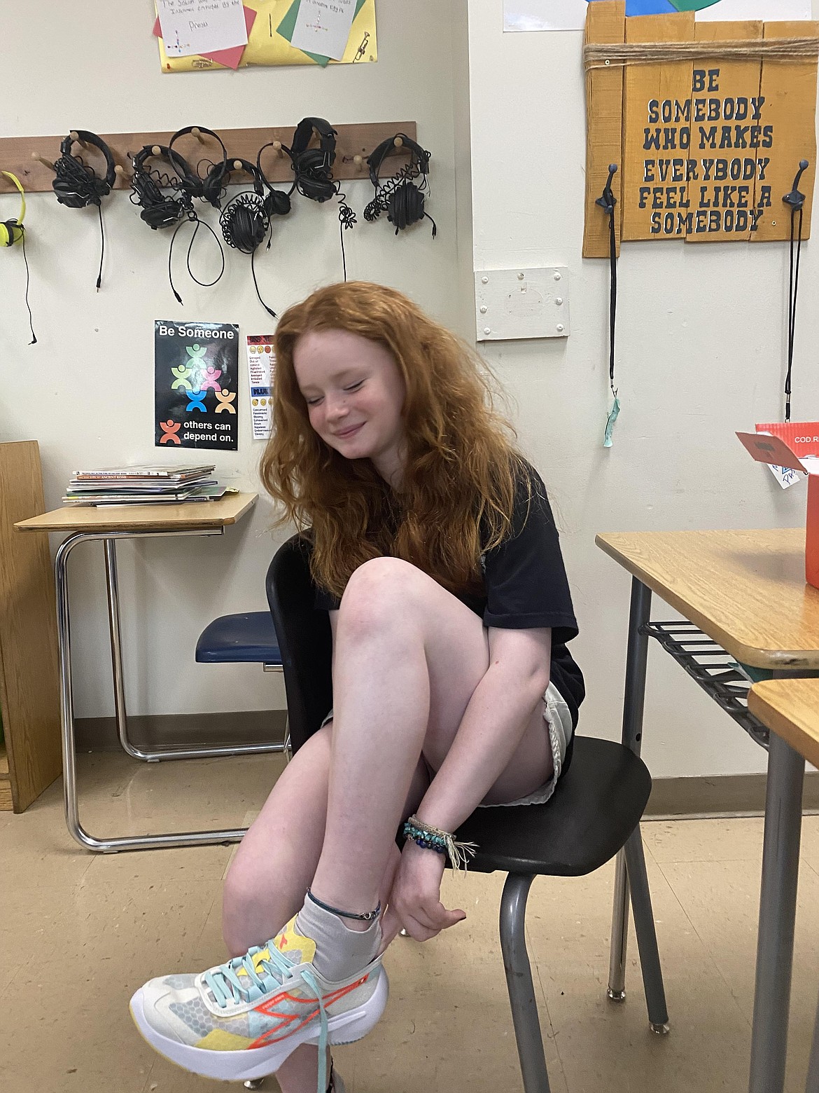 Seventh grade student Ellie Holm tries on new sneakers at Lakes Middle School Wednesday. Four students were able to choose from a selection of brand new sneakers as part of a program by Running Shoes 4 Kids, a local program that has been serving Kootenai County since 2012.