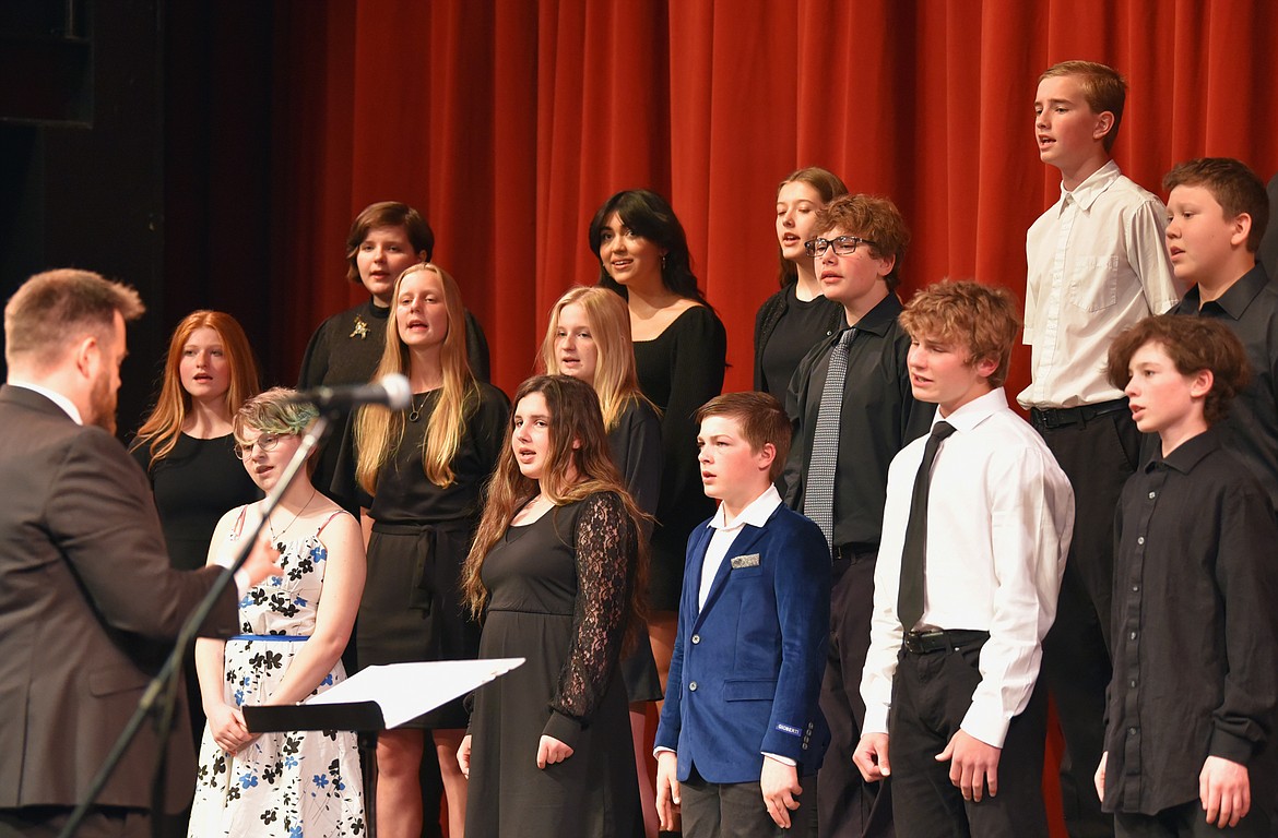 Members of the Whitefish Middle School Choir perform at a recent concert with guidance from choir director Sky Thoreson. (Julie Engler/Whitefish Pilot)