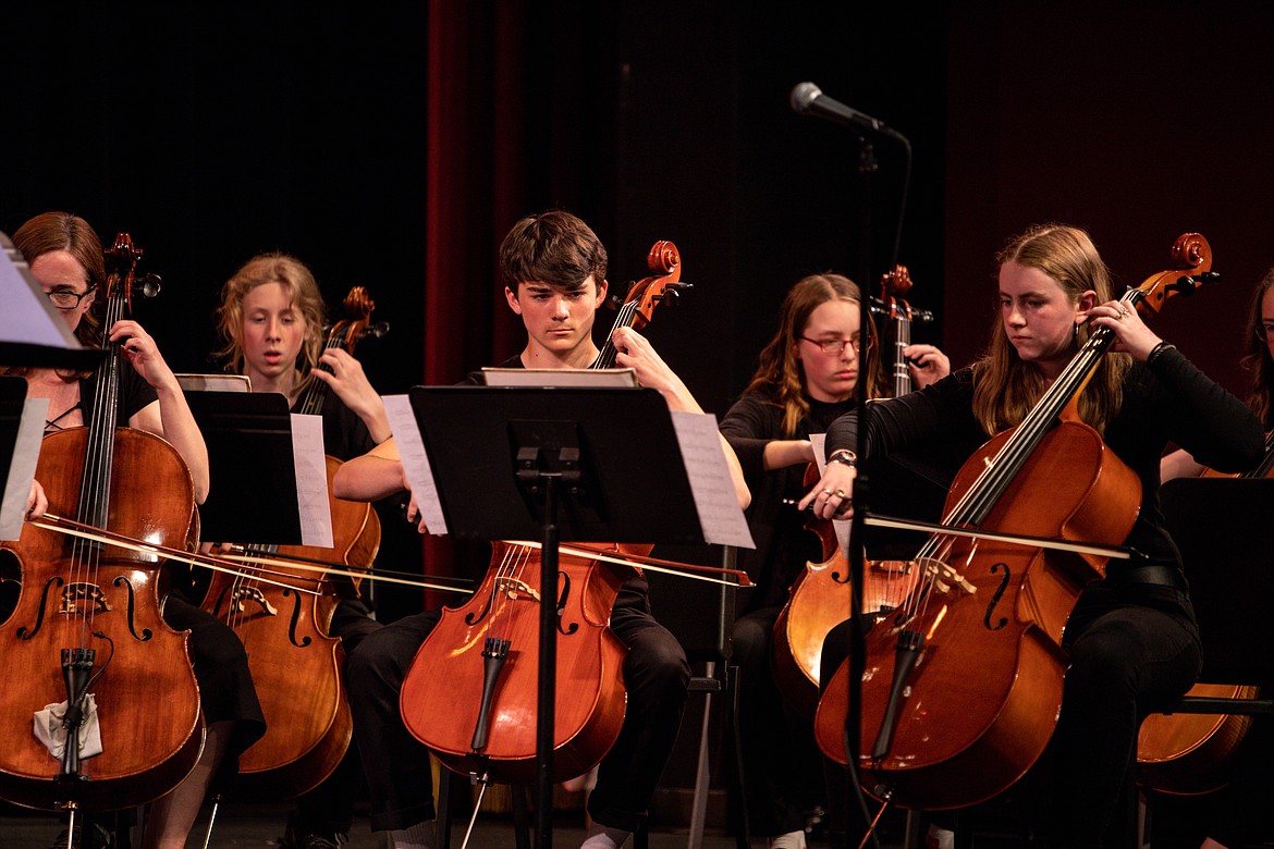 Eighth graders Koru Larimore, Isaac Middleton, Clare Helmstetler and Johanna Perkins play the cello. (JP Edge photo)