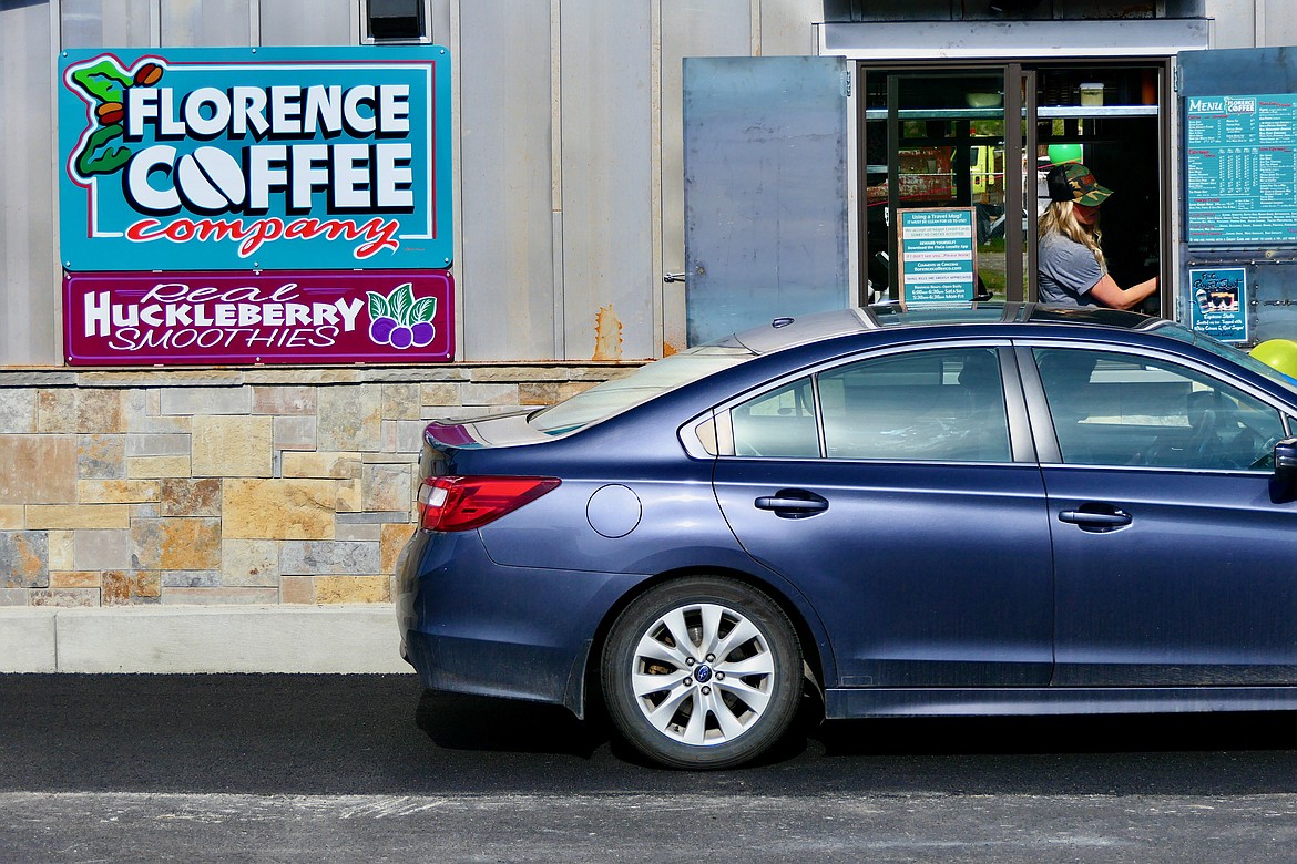 Sam Jochinsen greets a customer at the new Florence Coffee Company location in Whitefish on Thursday, June 9. (Matt Baldwin/Daily Inter Lake)