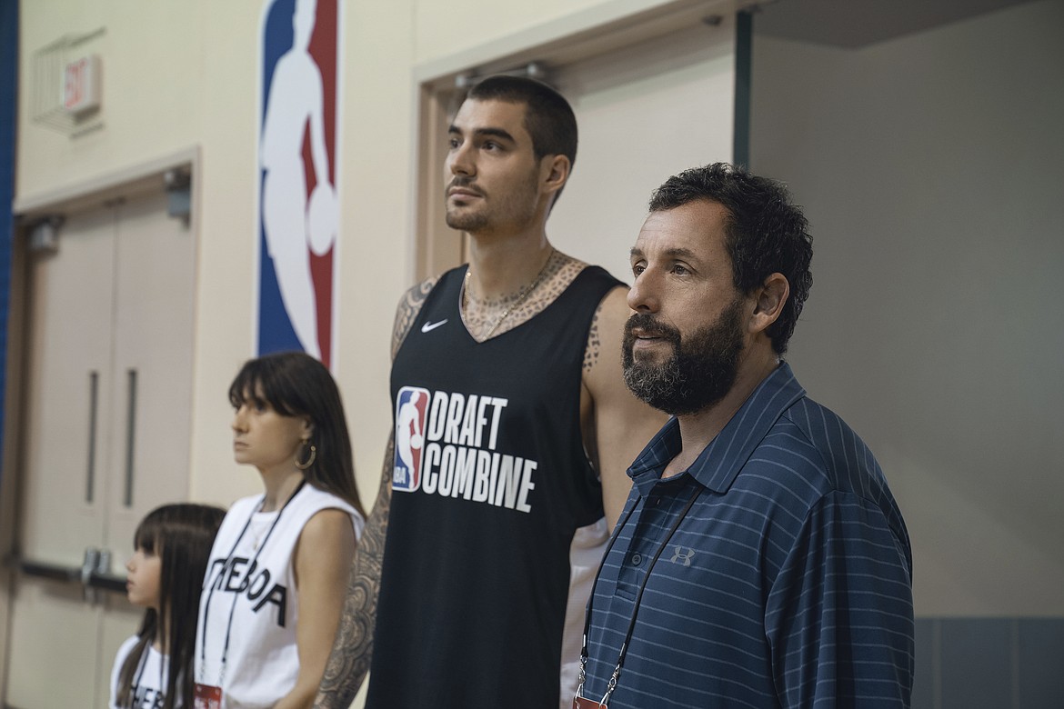 This image released by Netflix shows Ainhoa Pillet, from left, Maria Botto, Juancho Hernangomez and Adam Sandler in a scene from “Hustle.” (Scott Yamano/Netflix via AP)