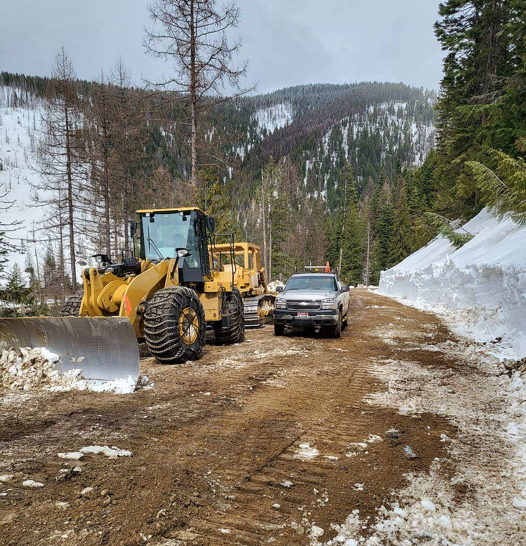 Crews from Shoshone County Public Works clear snow off the road that heads toward Moon Pass.