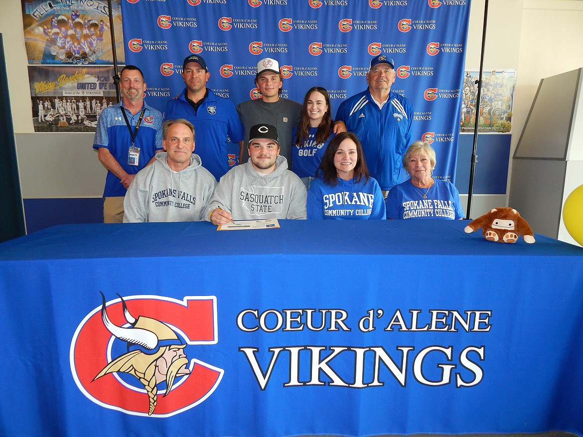 Courtesy photo
Coeur d'Alene High senior Cole Jaworski recently signed a letter of intent to play golf at Community Colleges of Spokane. Seated from left are Doug Jaworski (dad), Cole Jaworski, Ann Jaworski (mom) and Laurie Schwenke (grandmother); and standing from left, Bill White, Coeur d'Alene High athletic director; Chase Bennett, Coeur d'Alene High boys golf coach; Justin Jaworski (brother), Julia Jaworski (sister) and Larry Schwenke (grandfather).