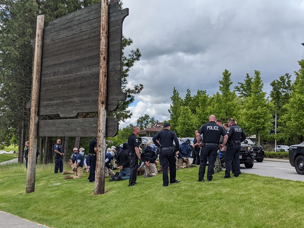 Law enforcement personnel detain 31 confirmed members of the Patriot Front, a white nationalist, fascist group, who were arrested Saturday in Coeur d'Alene on suspicious of conspiracy to riot.