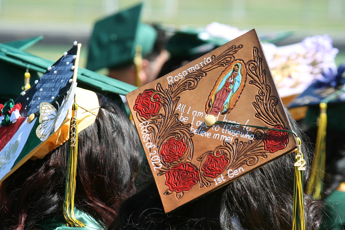 A first-generation Quincy High School senior explains her motivation on her cap during Saturday’s ceremony.