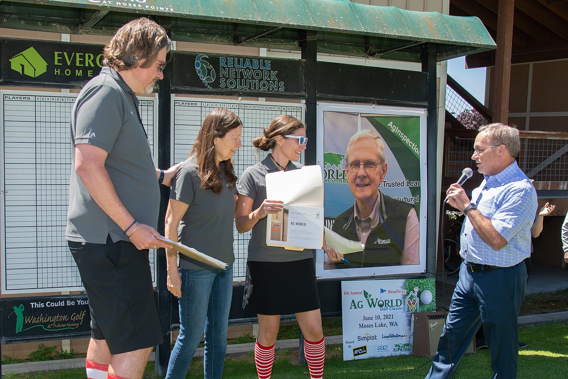 In 2021, Ag World’s Bryan Henninger (left), Judy Henninger (left center) and Melanie Finch (right center) lead the show.