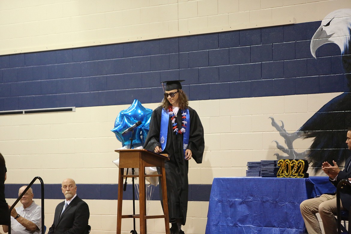 RISE Academy Class Speaker Jameson Haworth walks up to the stage before giving his speech during graduation.