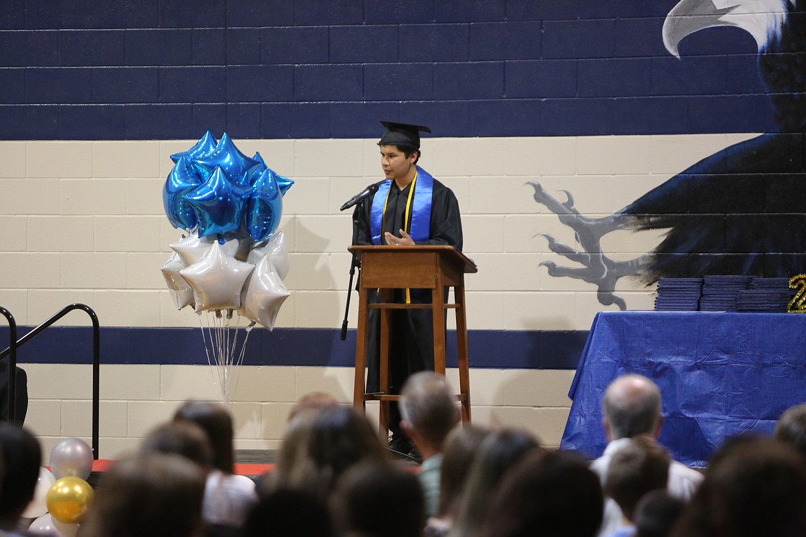 Valedictorian Sebastian Bustos looks on at the crowd during his speech at graduation.