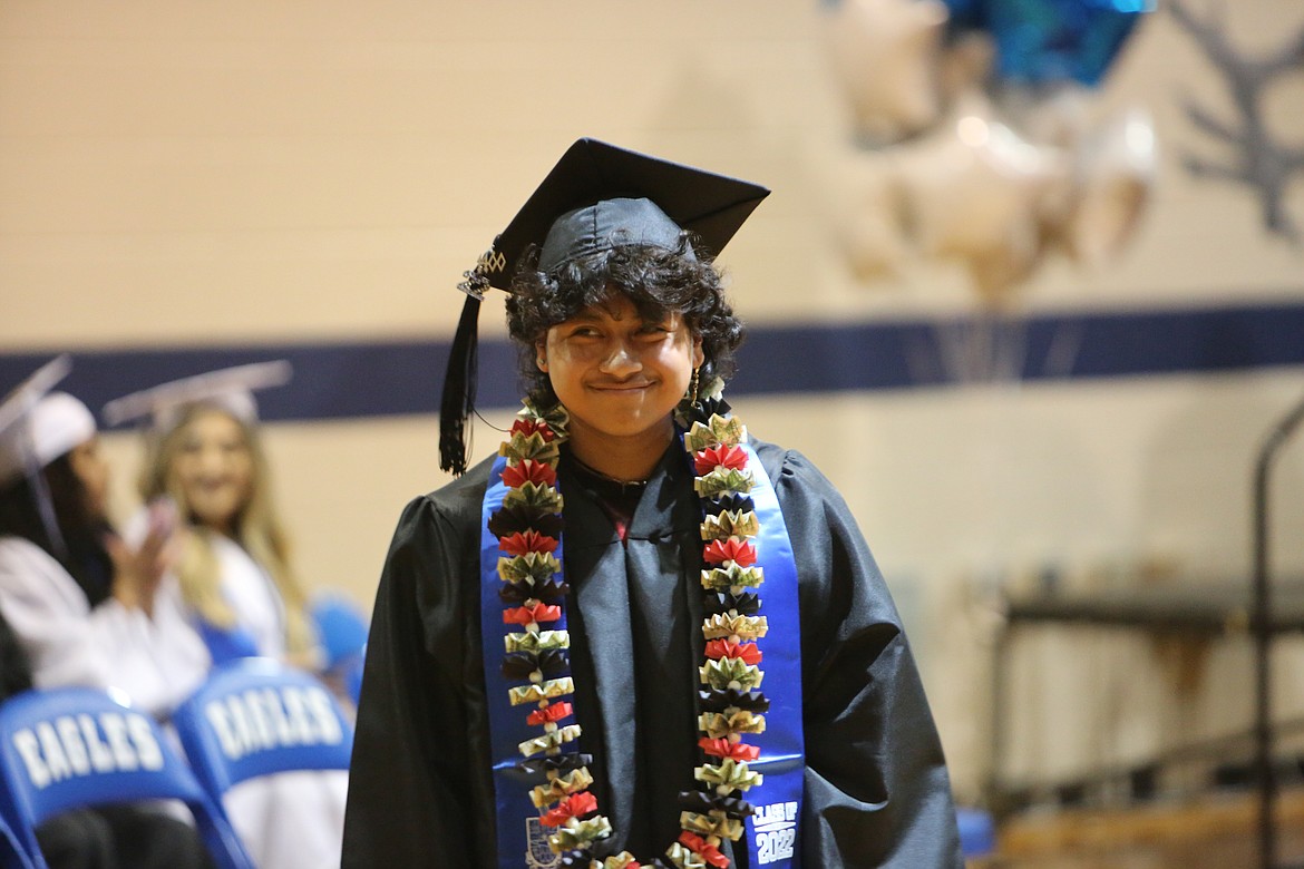 A freshly graduated Soap Lake High School Student walks away from the stage after receiving his diploma on June 11, 2022.