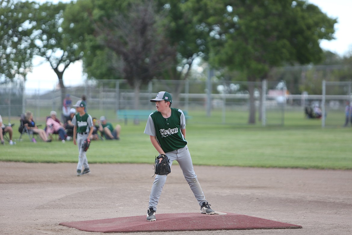 A Chelan pitcher looks on at his catcher during a game in the 2022 Pete Doumit Memorial Tournament.