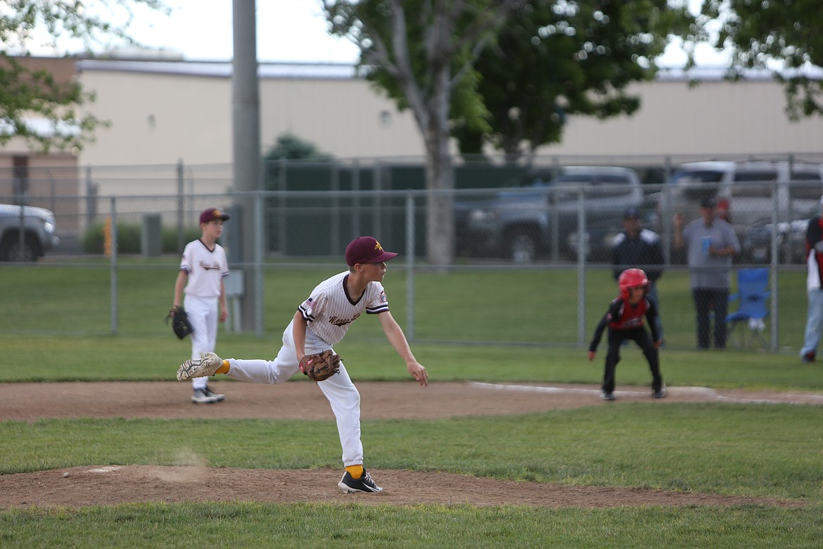 A Moses Lake pitcher unleashes a pitch against Othello during a tournament game. The same pitcher also hit a home run over the fence earlier on Saturday.