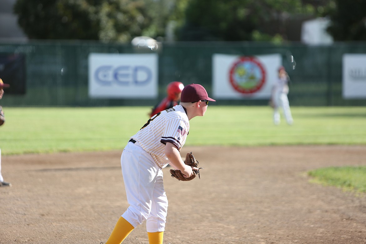 A Moses Lake third baseman peers on, waiting for a ball to come his way.