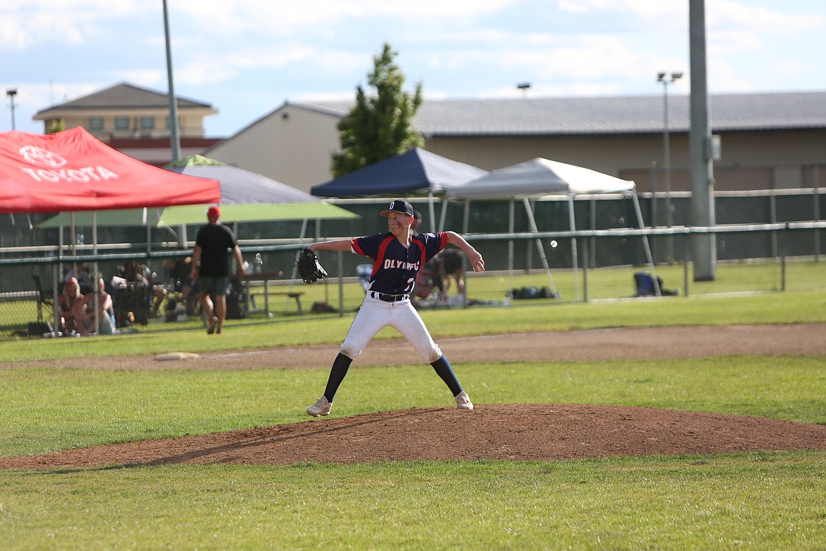 A player on Olympic Youth Baseball goes through his pitching motion during a tournament game.