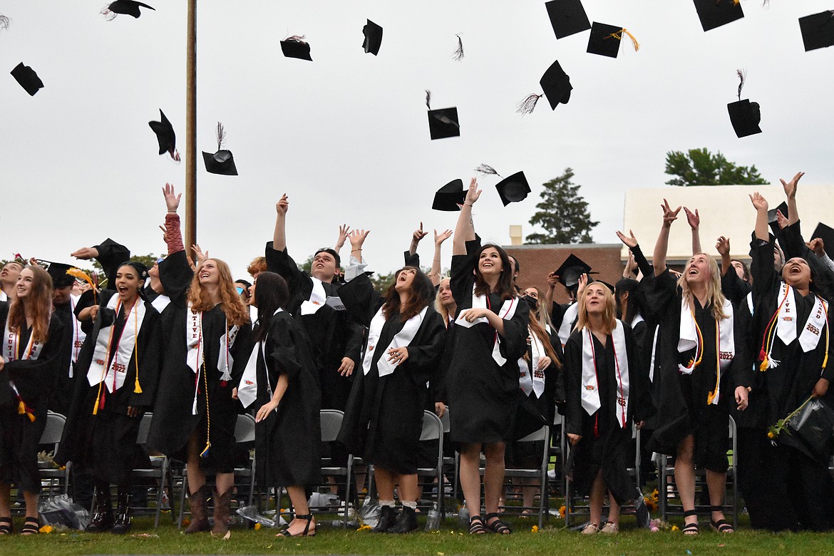 Graduates threw their caps in the air in celebration of the completion of the ceremony.