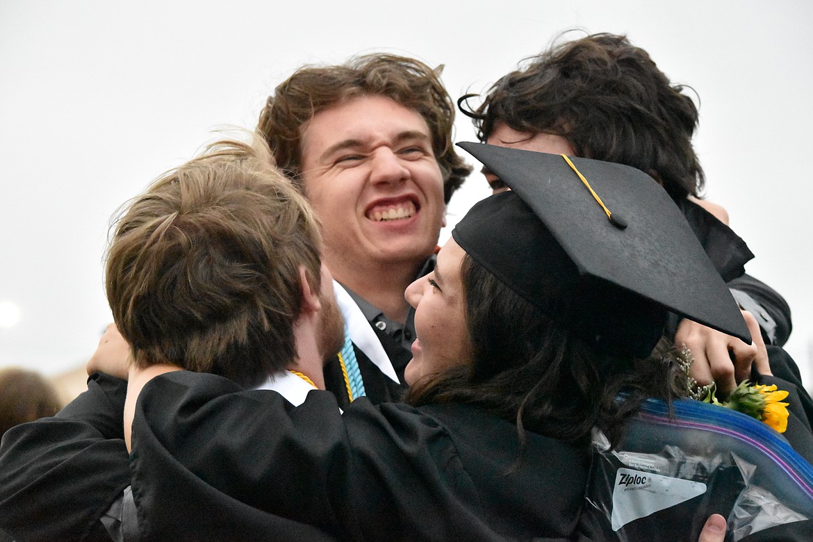 Graduates hugged after the ceremony.