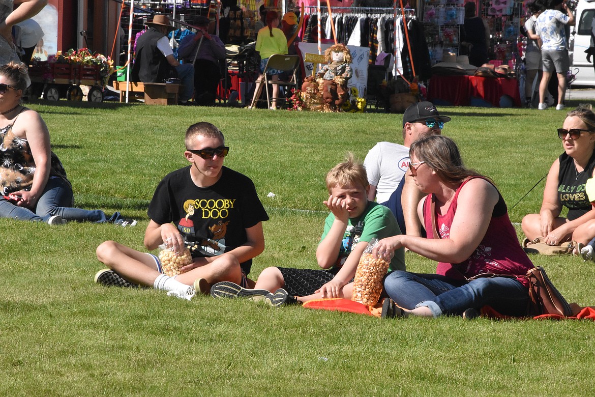 Lots of families grabbed a snack from a vendor before sitting in the grass of the courthouse to watch the Wenatchee Youth Circus or one of the performing bands Saturday.