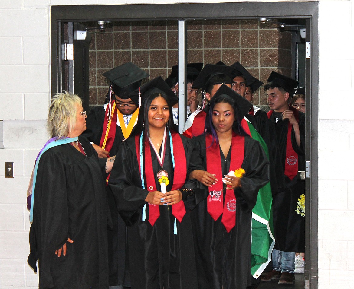 Wahluke High School students file into the gym for their commencement ceremony Friday. 152 seniors graduated at the event.