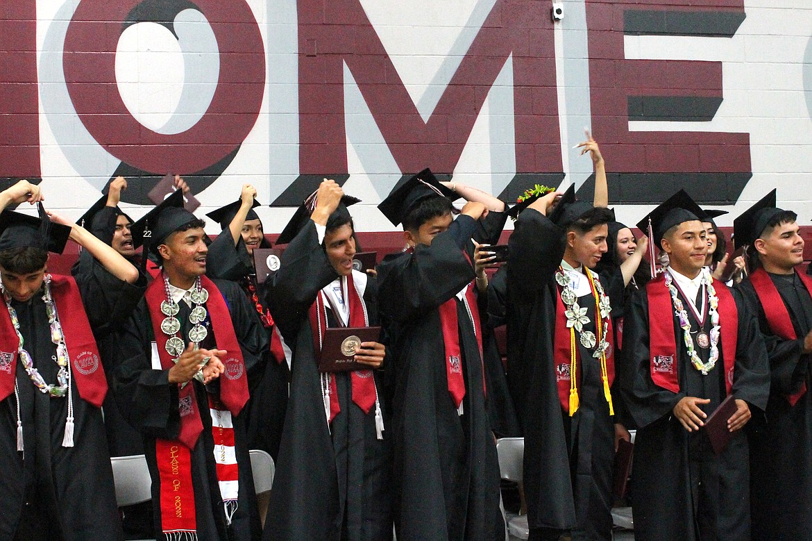 Newly-minted Wahluke High School graduates turn their tassels at commencement Friday. During the graduation ceremony, student speakers celebrated their class's triumph of completing school despite the unique challenges they faced.