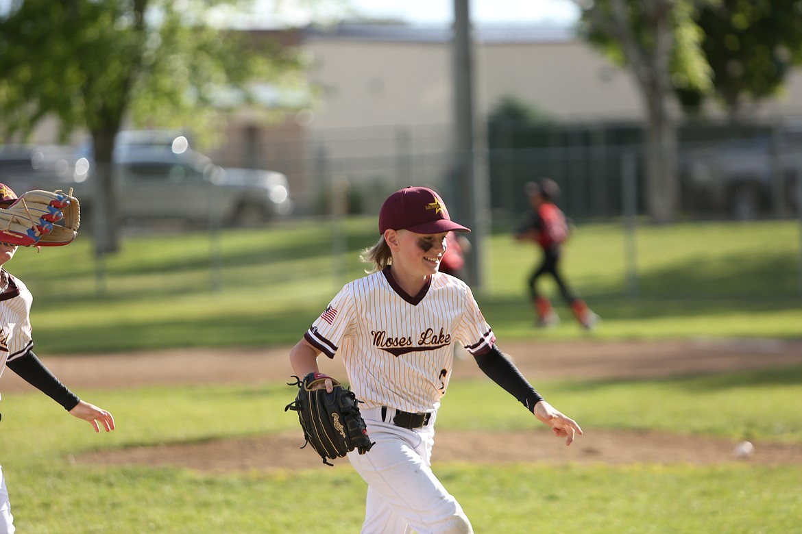 A Moses Lake youth baseball player tosses a pitch in a game against Othello during the second annual Pete Doumit Memorial Tournament. The Moses Lake Thunder wond the Babe Ruth event during the tourney.