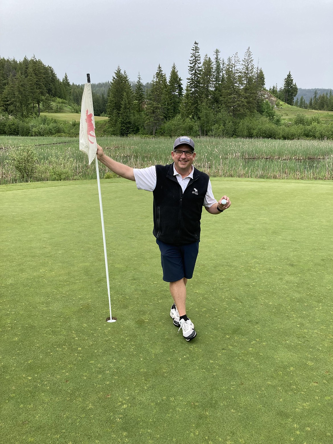 Tye Barlow poses with at hole number 7 at the Idaho Club on June 9, following his first career hole in one.