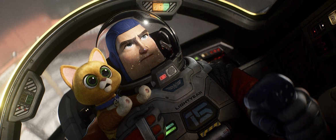 This image released by Disney/Pixar shows character Buzz Lightyear, voiced by Chris Evans, and Sox, voiced by Peter Sohn, in a scene from the animated film "Lightyear."