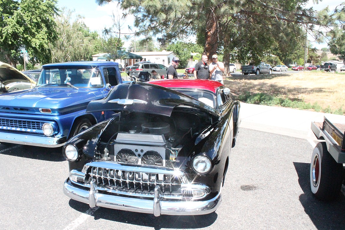 A 1951 chop-top owned by Matt Johnson gleams at the Little Big Show in Wilson Creek Saturday. Johnson ran across the vehicle on a trailer load of milk crates, he said, and restored it in three months.