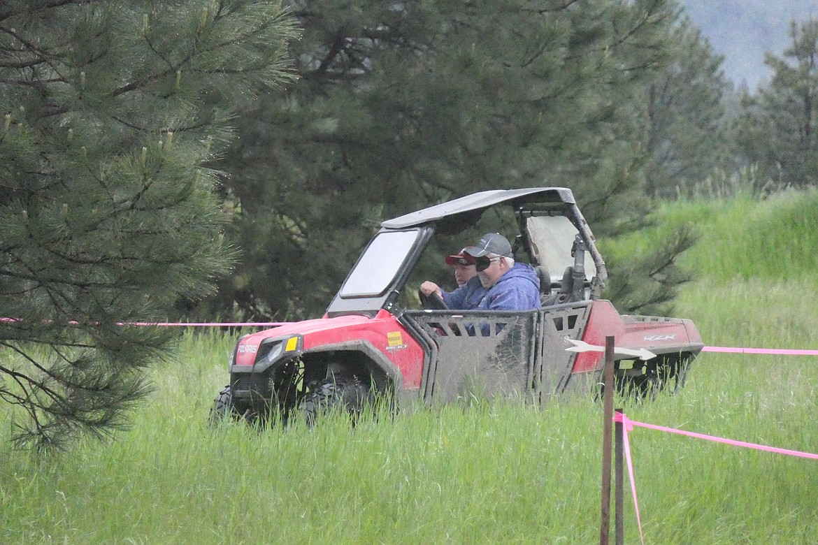 Marshanna and Mike Basham, Thompon Falls ATV enthusiasts, drive the course with Mike wearing a blind fold during the event this past Saturday at the Thompson Falls Elks Lodge.