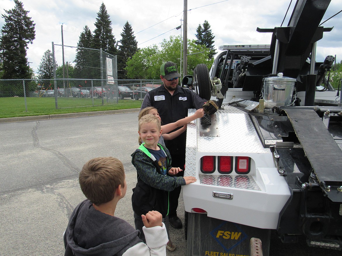 Idaho Hill Elementary students talk to a first responder during the school's annual Safety Day held at the end of the year. Students get a chance to talk to the first responders and other officials at the event