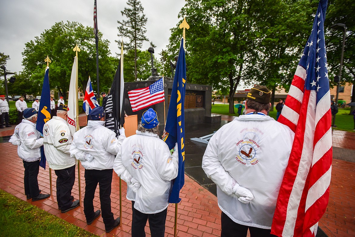 Members of the United Veterans of the Flathead Valley hold flags during a Flag Day ceremony at Depot Park in Kalispell on Tuesday, June 14. (Casey Kreider/Daily Inter Lake)