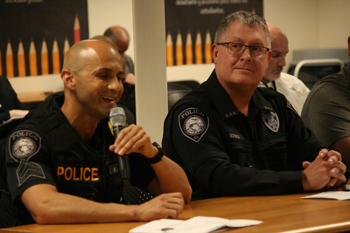 Othello Police Department Sergeant Aaron Garza (left) and OPD Chief Phil Schenck (right) detail some of the efforts being made to improve school security to the Othello School Board.