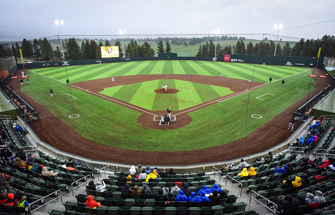 The Glacier Range Riders face the Billings Mustangs in the home opener at Flathead Field on Tuesday, June 14. Many fans chose to watch from under the concourse as a steady rain fell throughout the game. (Casey Kreider/Daily Inter Lake)