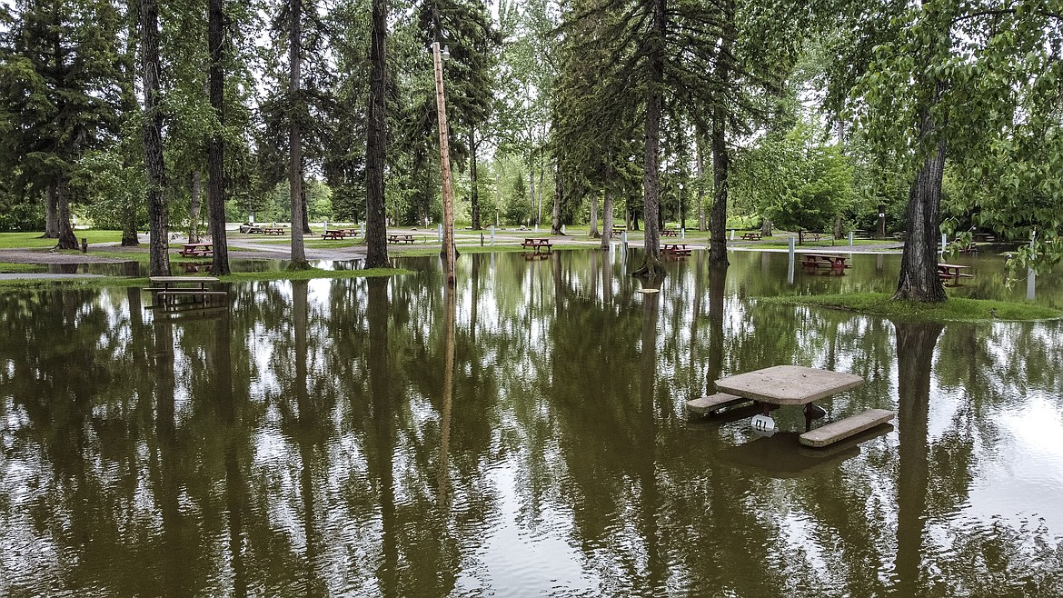 Floodwaters flow through Spruce Park RV Park on Wednesday, June 15. (JP Edge/Hungry Horse News)