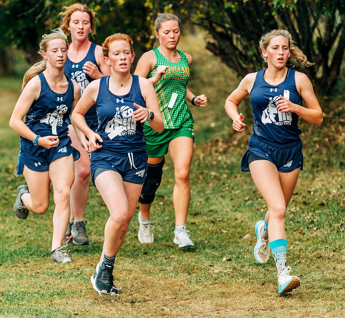 (front two runners left to right) Ceci Roemer and Camille Ussher at cross country meet 2021.