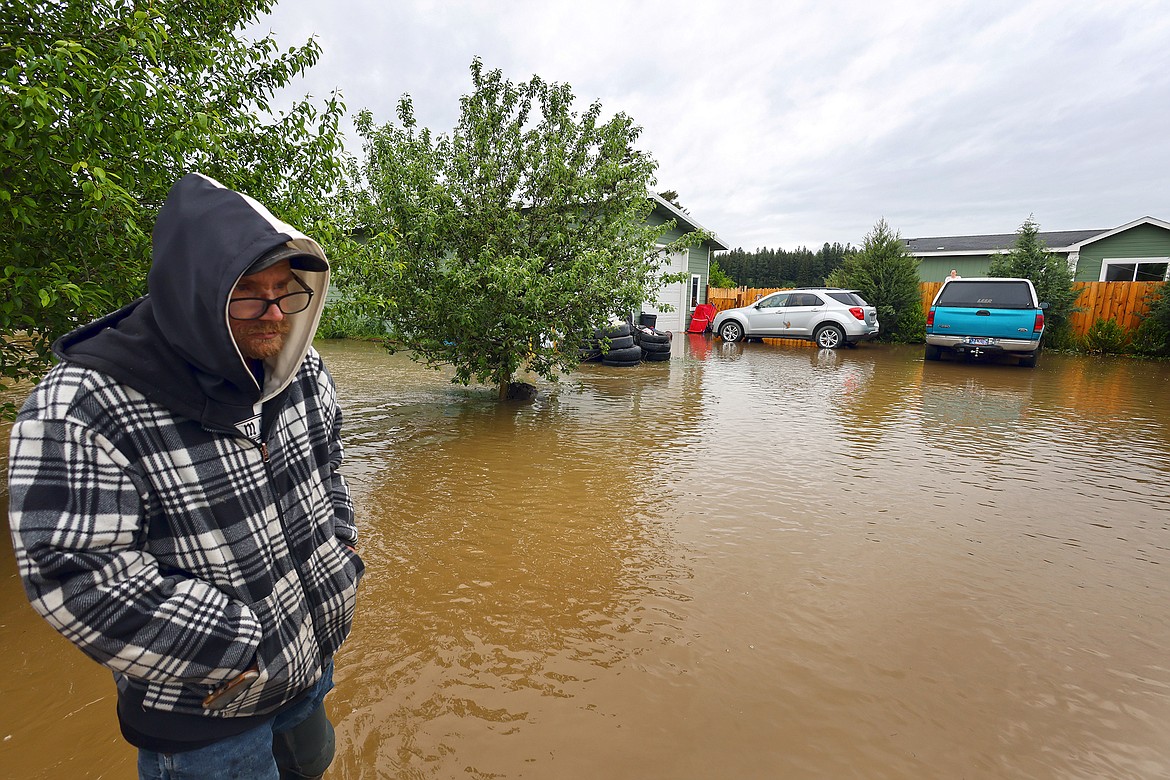 George Gockman surveys the flood damage around his home in Columbia Falls Wednesday, June 15. (Jeremy Weber/Daily Inter Lake)