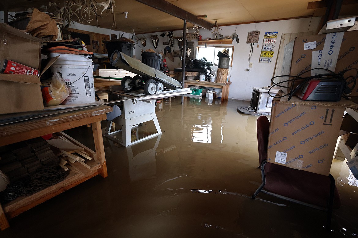 Flood waters invade a workshop at a home on U.S. Hwy 2 in Columbia Falls Wednesday, June 15. (Jeremy Weber/Daily Inter Lake)