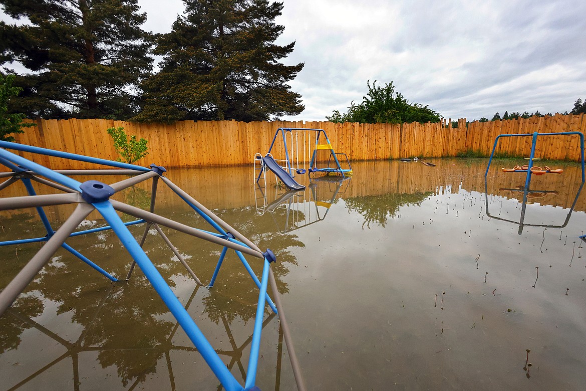 Flood waters inundate the backyard of a home on U.S. Hwy 2 in Columbia Falls Wednesday, June 15. (Jeremy Weber/Daily Inter Lake)