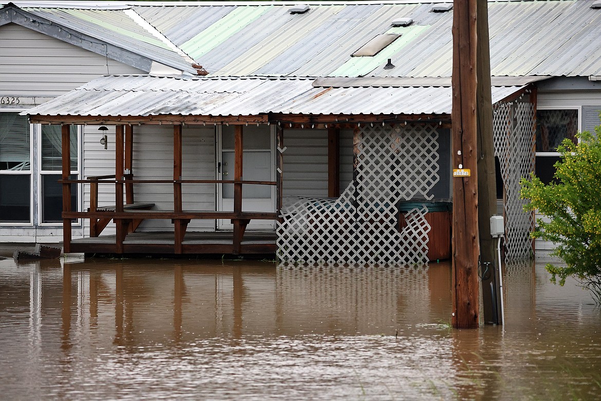 Flood waters surround a home on U.S. Hwy 2 in Columbia Falls Wednesday, June 15. (Jeremy Weber/Daily Inter Lake)